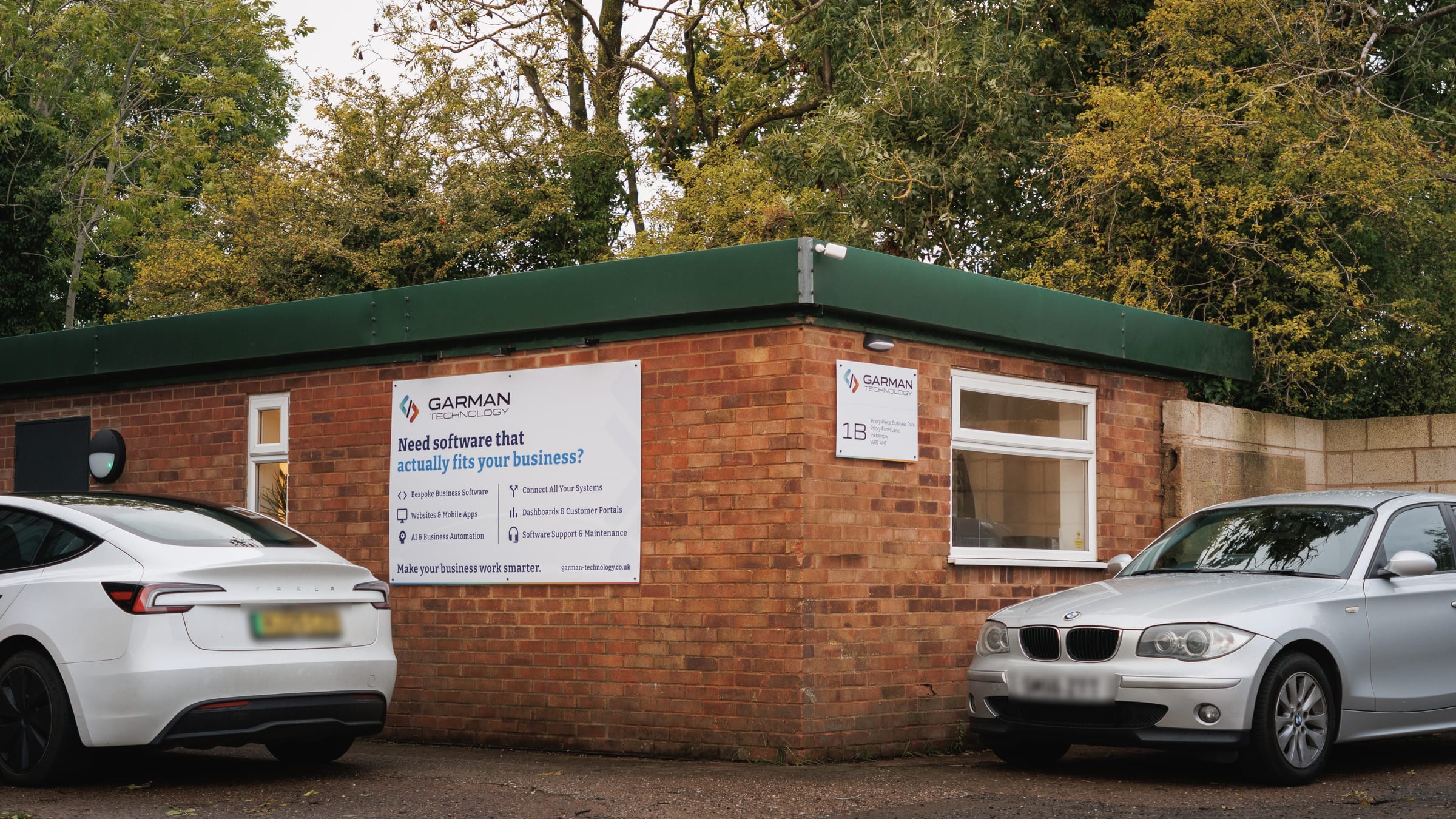 The Garman Technology office in Inkberrow: a brick building with the company sign and parking out front